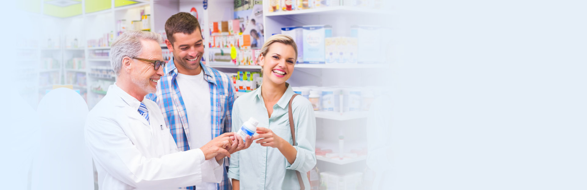 pharmacist and couple laughing